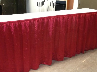 Photo for the news post: Table Skirts – 42″ Height – Red